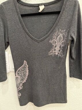Gray V-Neck Long Sleeve Top with Embellished Fleur-de-Lis and Wing